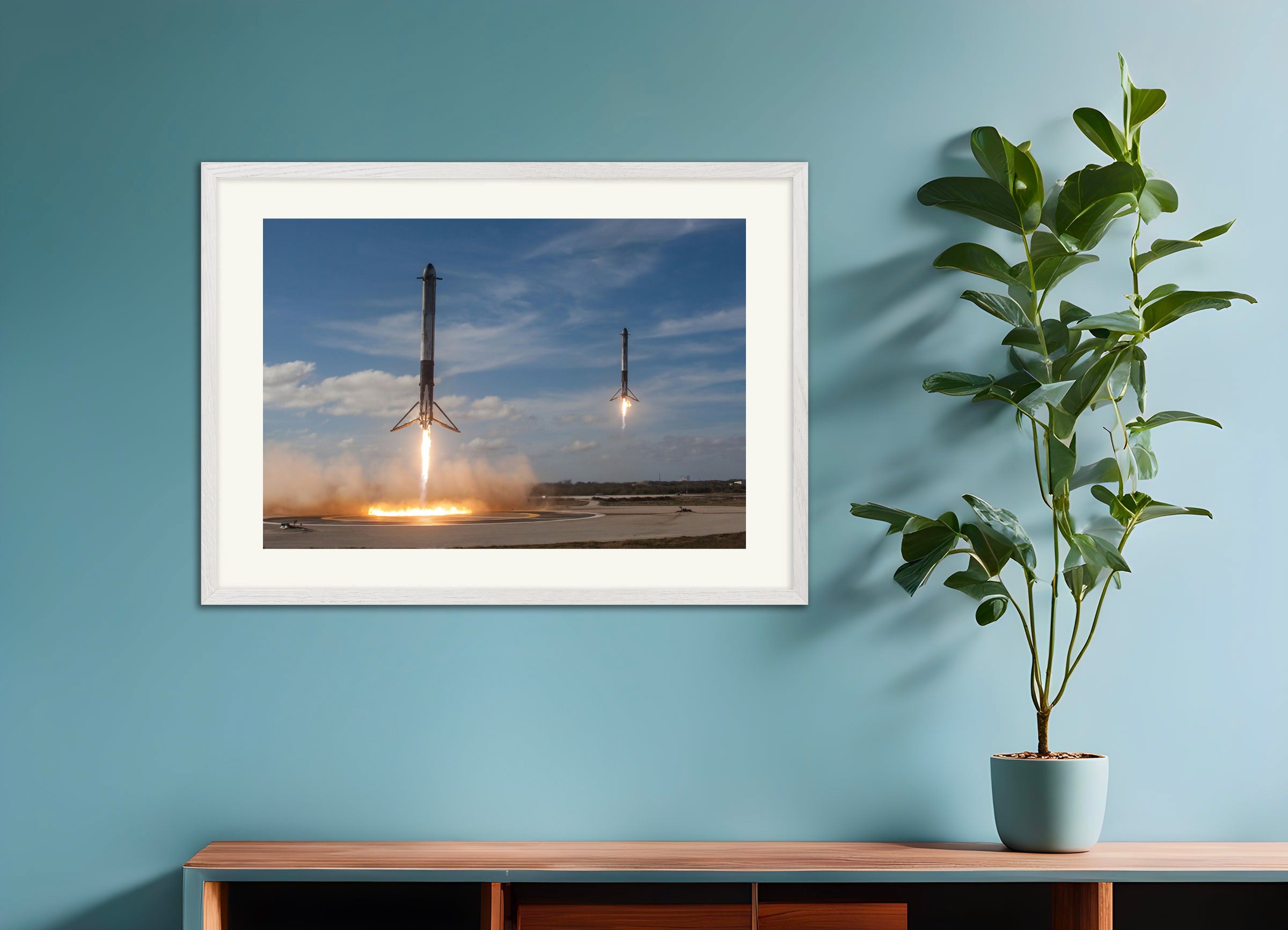 白い木製フレームのポスター:SpaceX、2つのロケットが着陸する様子